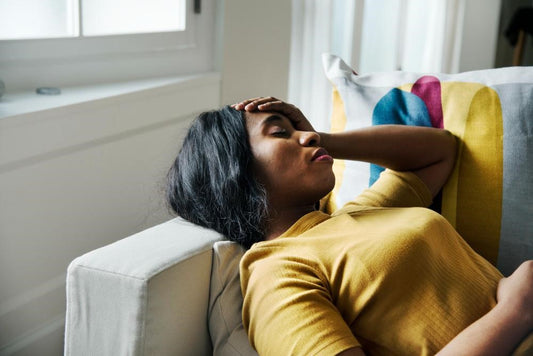 woman lying on a couch