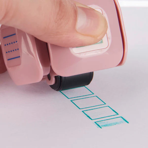 LegiLiner LegiCube Self-Inking Teacher Stamp - Math and Handwriting Lines Multi-Roller Stamp stamping green boxes from AskSAMIE