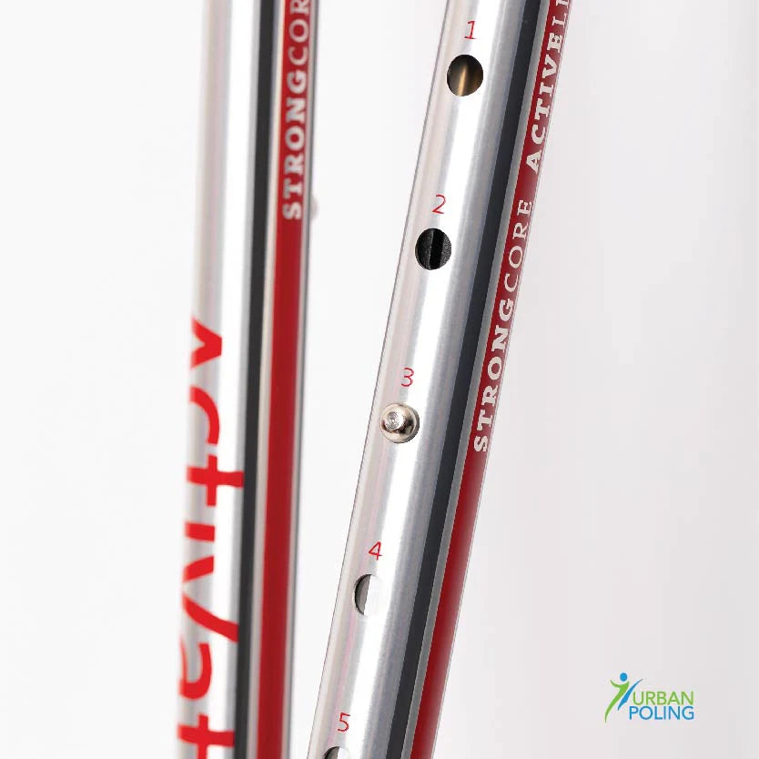 Close up on two Strongcore Active poling shafts on Activator poles with measurement markings on a white background.