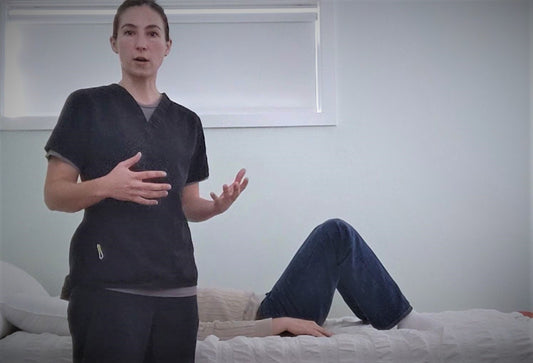 woman standing next to bed