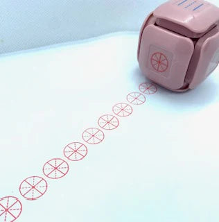LegiLiner LegiCube Self-Inking Teacher Stamp - Math and Handwriting Lines Multi-Roller Stamp stamping red circle pie eights in white sheet from AskSAMIE
