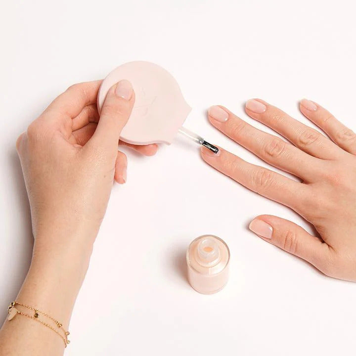 Poppy Nail Polish being applied on nails