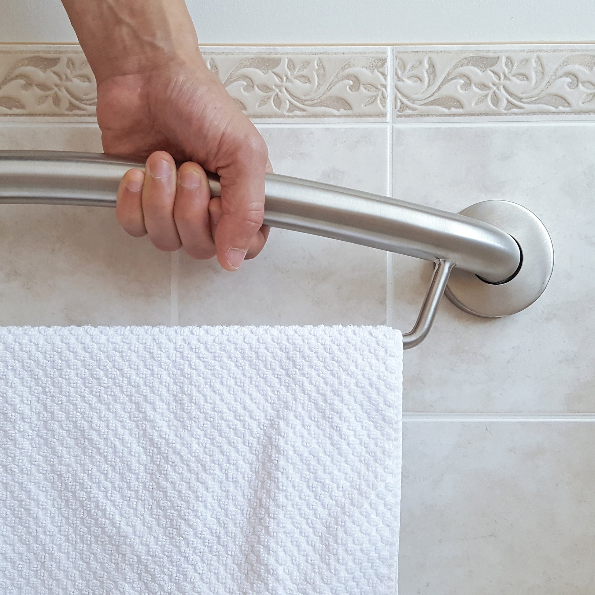 person using towel grab bar