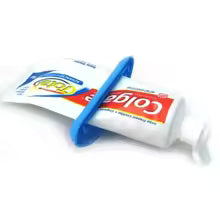 Toothpaste squeezer flattening a tube to empty the last of the paste, also works on ointment, cream, and lotion tubes
