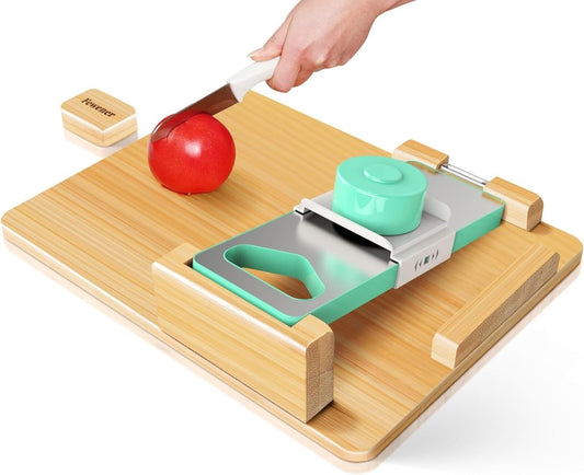 Bamboo one-handed cutting board with a green food clamp holding a tomato steady while a hand slices it with a knife