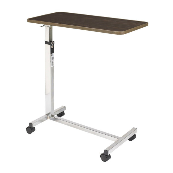Drive Medical tilt-top overbed table with a 30 by 15 inch walnut laminate top on a chrome H-base with casters, for meals and reading in bed