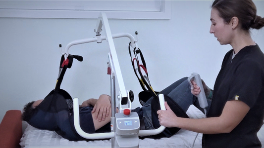 people using hoyer lift