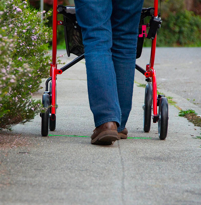 person using walker with nexstride