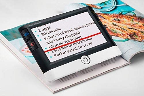 Visolux Digital in use over a cookbook to magnify text from AskSAMIE