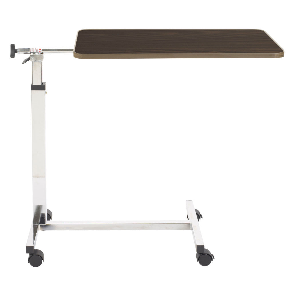 Side view of the overbed table showing the top extending past the column so it reaches over a hospital bed, recliner, or chair