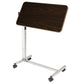 Overbed table top tilted at an angle to hold a book or tablet for reading in bed, adjustable up to 33 degrees in either direction