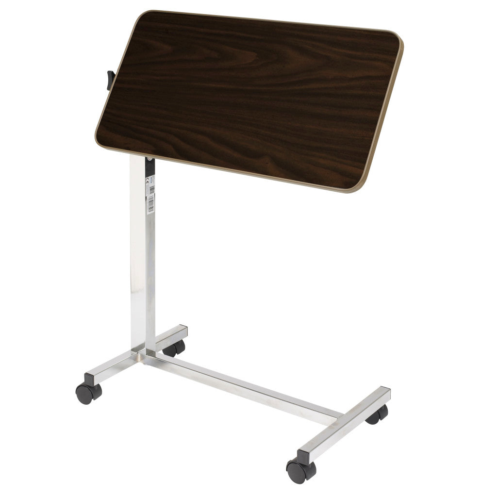 Overbed table top tilted at an angle to hold a book or tablet for reading in bed, adjustable up to 33 degrees in either direction