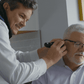 doctor checking patient ear YesHearing at AskSAMIE