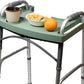 Green walker tray holding a full breakfast of coffee, cereal and fruit on a folding walker, so an entire meal can be carried to the table in one trip.