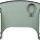 Top view of the sage green walker tray seated flat on folding walker handles, showing the wide flat carrying surface and the deep molded cup holder.