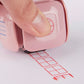 LegiLiner LegiCube Self-Inking Teacher Stamp - Math and Handwriting Lines Multi-Roller Stamp stamping red box of square quarters in white sheet from AskSAMIE
