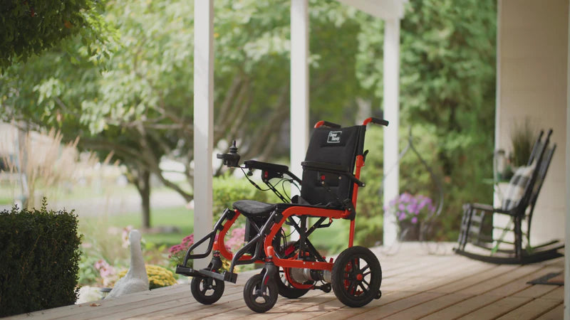 Lightweight Folding Power wheelchair on a patio from AskSAMIE