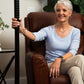 woman sitting by titan transfer pole