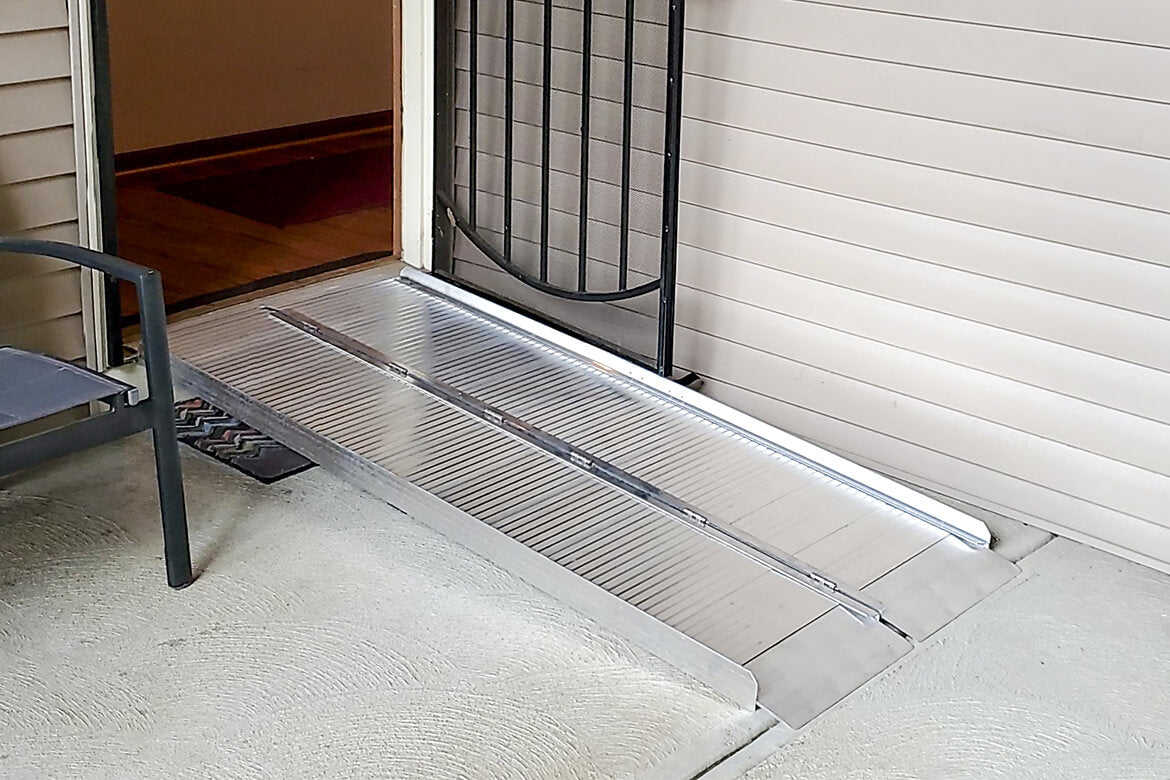 suitcase ramp shown deployed in front of door with elevated floor from AskSAMIE