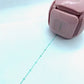 LegiLiner LegiCube Self-Inking Teacher Stamp - Math and Handwriting Lines Multi-Roller Stamp stamping green lines in white sheet from AskSAMIE