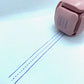 LegiLiner LegiCube Self-Inking Teacher Stamp - Math and Handwriting Lines Multi-Roller Stamp stamping blue lines dotted in white sheet from AskSAMIE