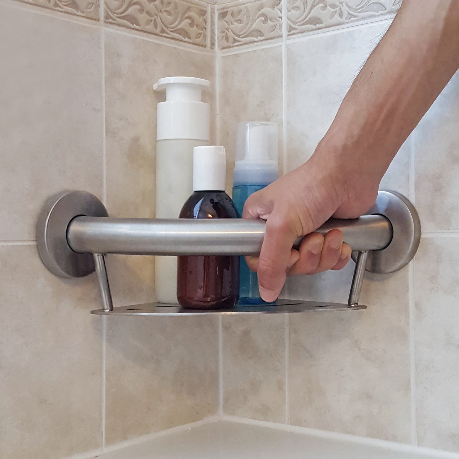 person using grab bar shelf in shower