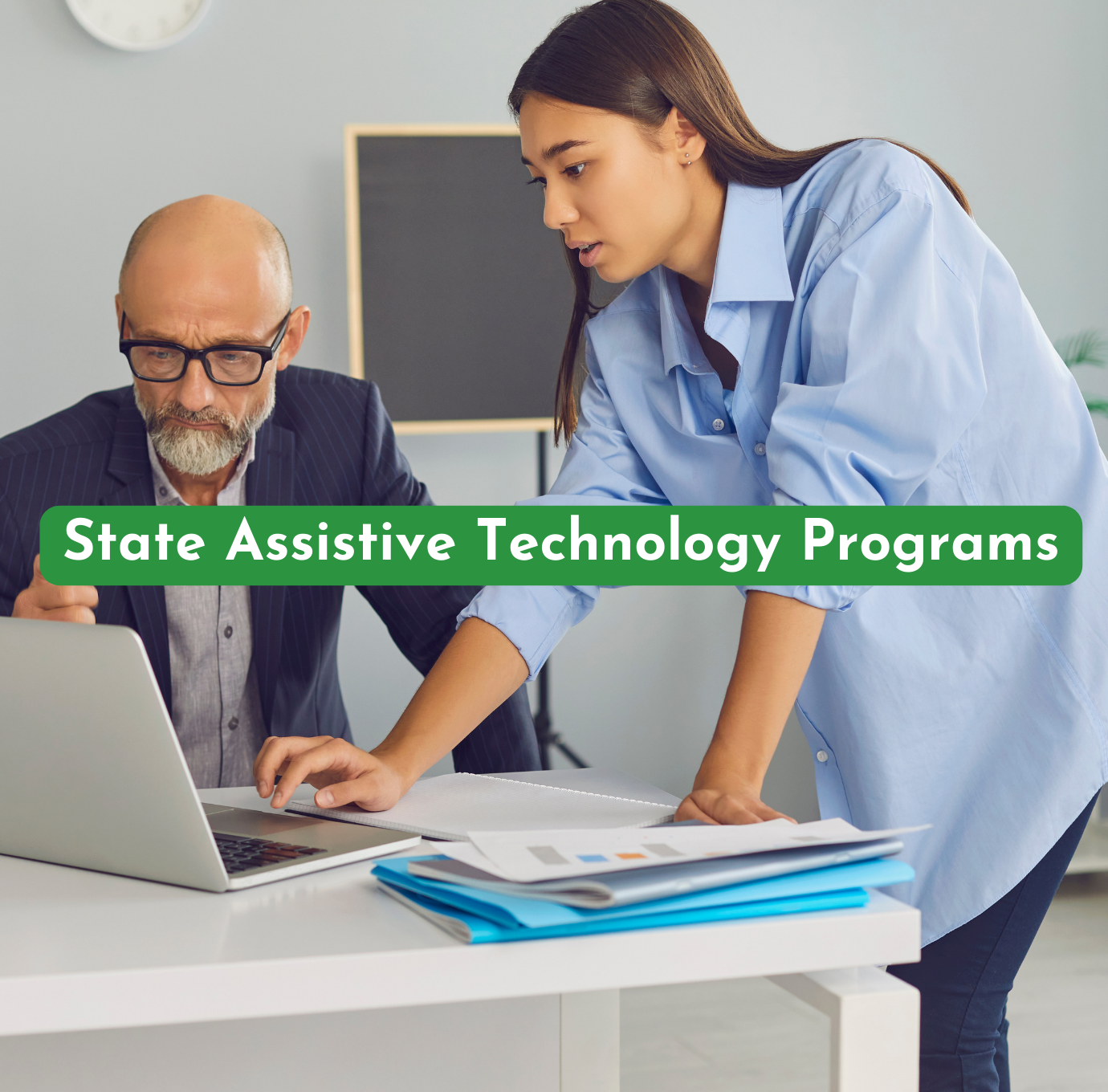 older man being helped on a computer by a younger woman highlighting services at a state assistive technology program referenced by AskSAMIE