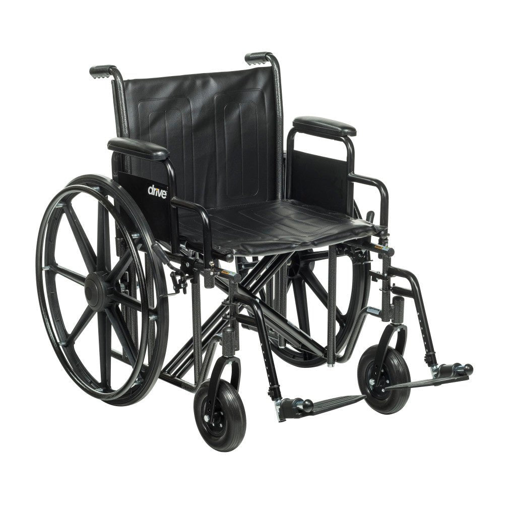22 inch heavy-duty wheelchair with detachable padded desk arms and swing-away footrests, rated to 450 lb for larger users.