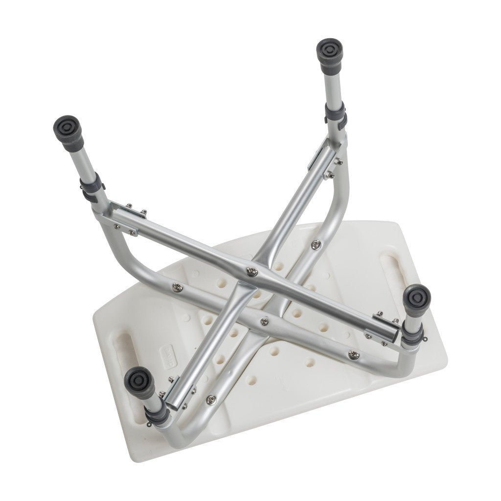 Underside of the bariatric shower chair showing the cross-frame brace and the four legs that adjust height in 1 inch steps.