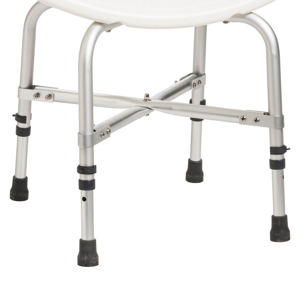 Close-up of the X-shaped cross brace under the shower chair seat, riveted to the legs so the chair stays solid for users up to 500 lb.