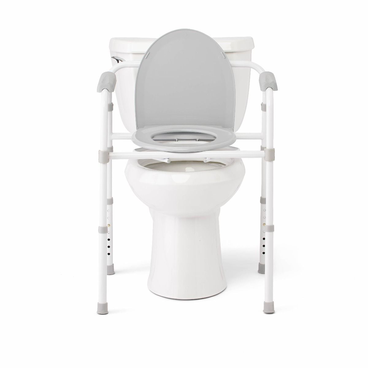 Medline Guardian commode frame positioned over a standard toilet, used as a raised toilet seat and safety frame with support arms
