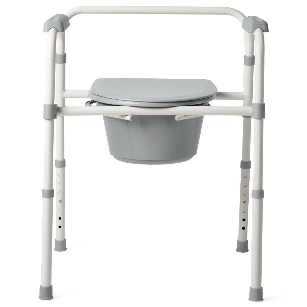 Medline Guardian 3-in-1 folding steel bedside commode in white and gray with padded seat, lid, armrests, and removable gray bucket
