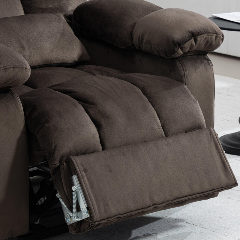 Close-up of the lift recliner's raised footrest and plush pillow-top seat cushions in brown velvet.