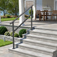 5 step outdoor stair railing with a 68.9 inch black handrail bolted to stone patio steps, giving support the full length of the steps.