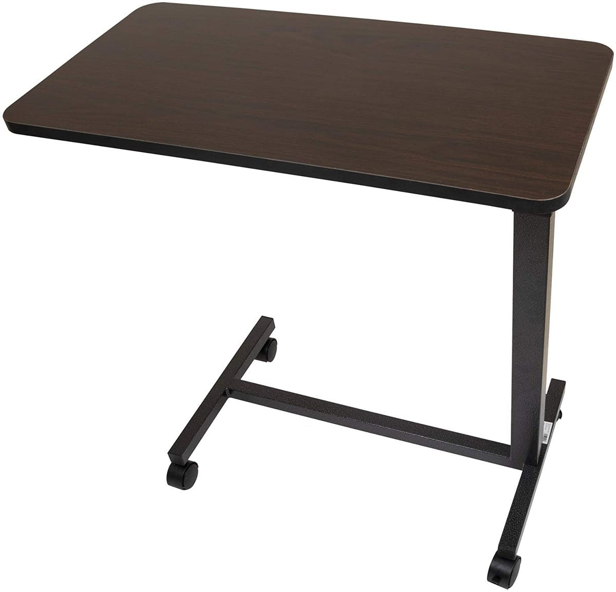 Angled view of the rolling overbed table showing the 15 by 30 inch tabletop, single steel column, and swivel casters that slide under a bed or recliner.