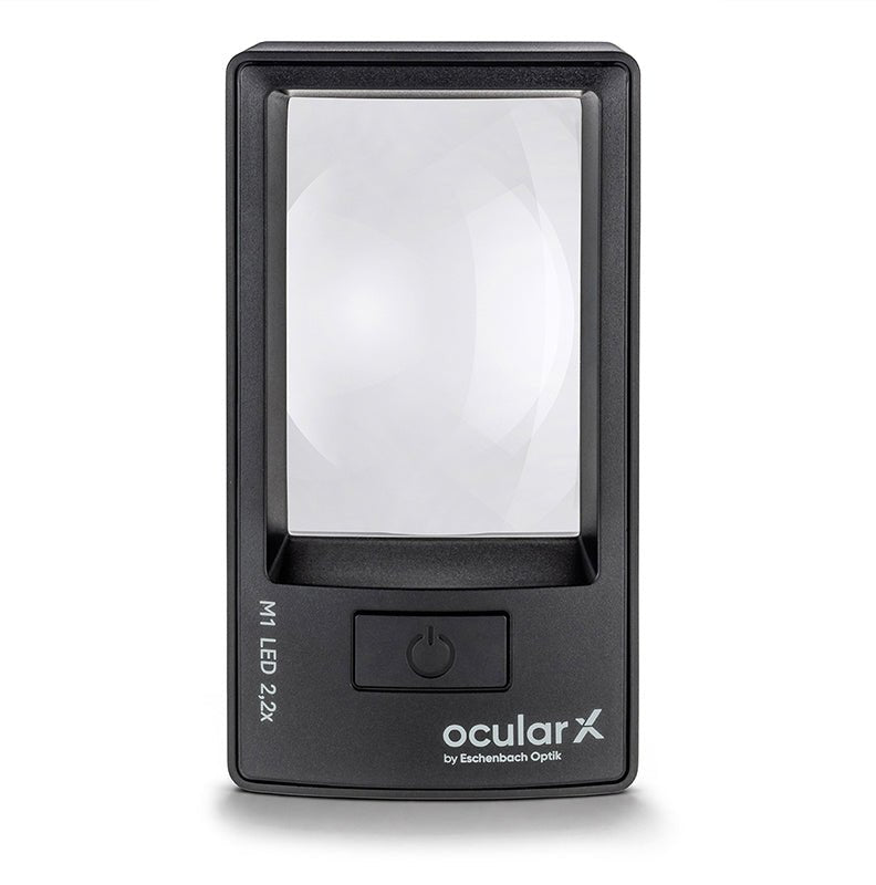 ocularX M1 2.2x lighted magnifying glass with a 76 x 50 mm rectangular lens and large on/off button for reading with low vision.
