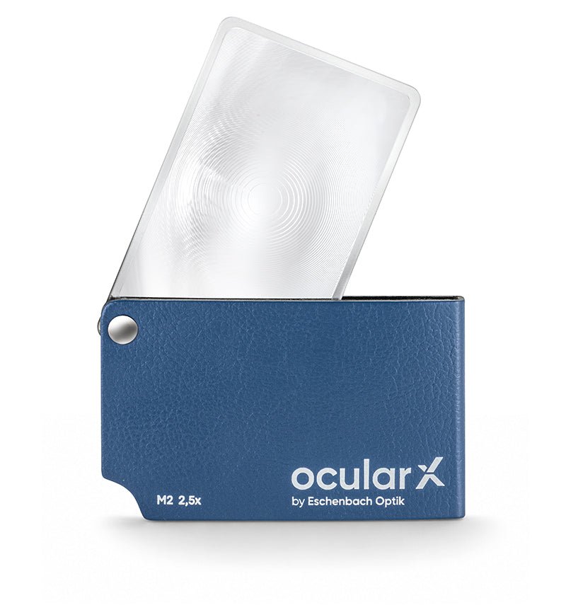 ocularX M2 2.5x folding pocket magnifier, credit card size with a 74 x 48 mm lens and blue case that folds over to protect it.