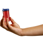 Hand holding a red Patriotic SnapSlide pill bottle with a navy cap to show its size, about the same as a standard pharmacy prescription bottle.