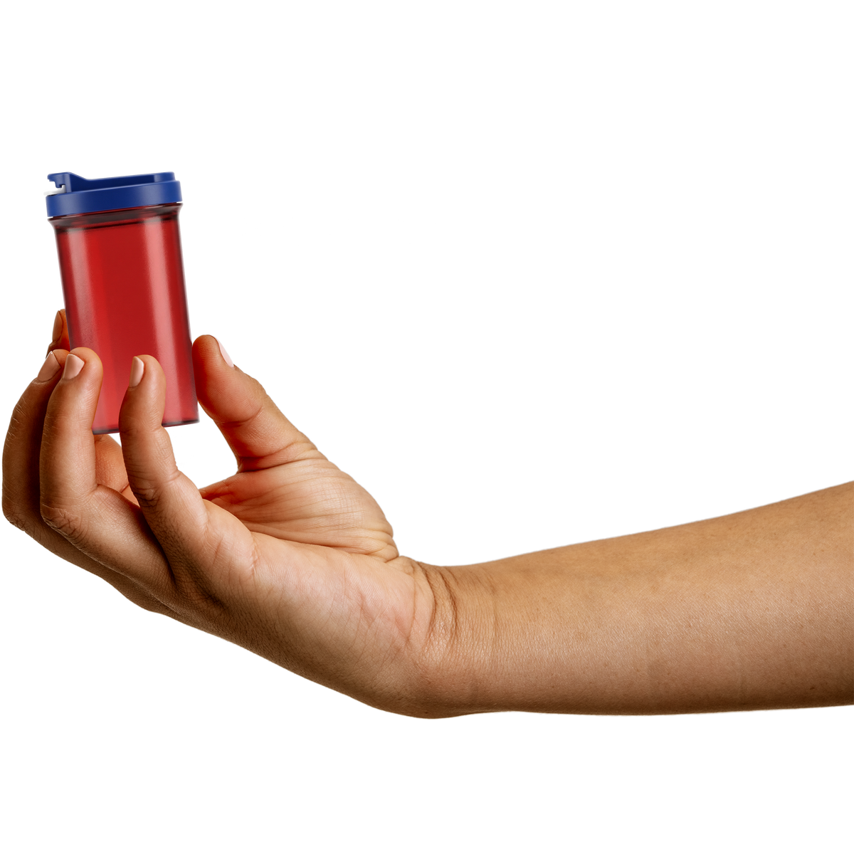 Hand holding a red Patriotic SnapSlide pill bottle with a navy cap to show its size, about the same as a standard pharmacy prescription bottle.