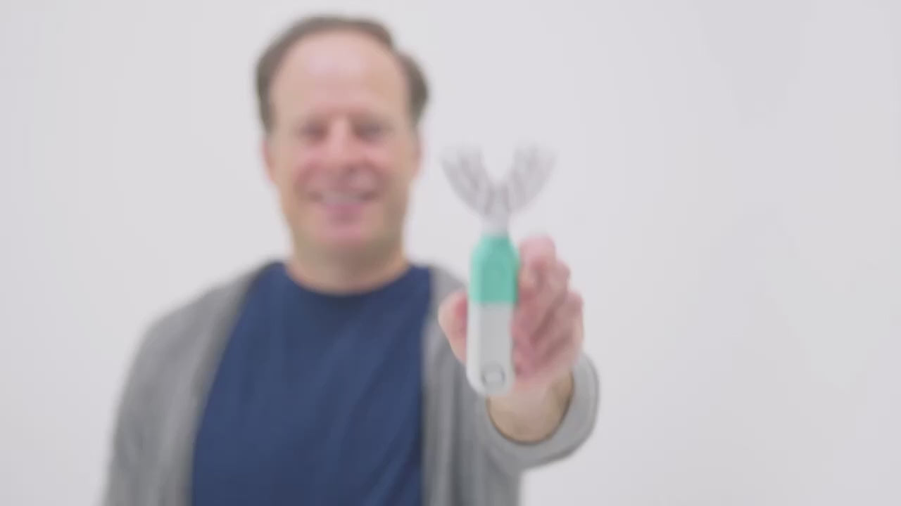 Demonstration of the SymplBrush automatic toothbrush cleaning a full arch of teeth in one 30 second guided cycle, with no brushing motion required.