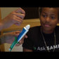 Occupational therapist Dr. Brandy Archie demonstrates how a toothpaste squeezer dispenses paste with an open hand instead of a pinch grip
