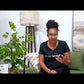 Video of Dr. Brandy Archie, occupational therapist and founder of AskSAMIE, bending the wire-reinforced leg lifter strap to fit her foot, then hooking the foot loop and pulling with both hands to lift her leg into bed without using her leg muscles.