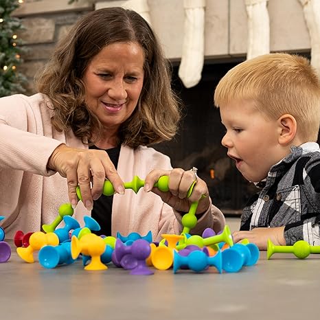woman and child playing with Squigz Suction Toys from AskSAMIE