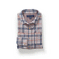 Folded grey flannel shirt with navy and peach plaid animating open to show its magnetic front placket and striped lining