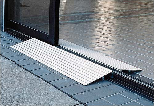 Aluminum threshold ramp pictured at a sliding glass door