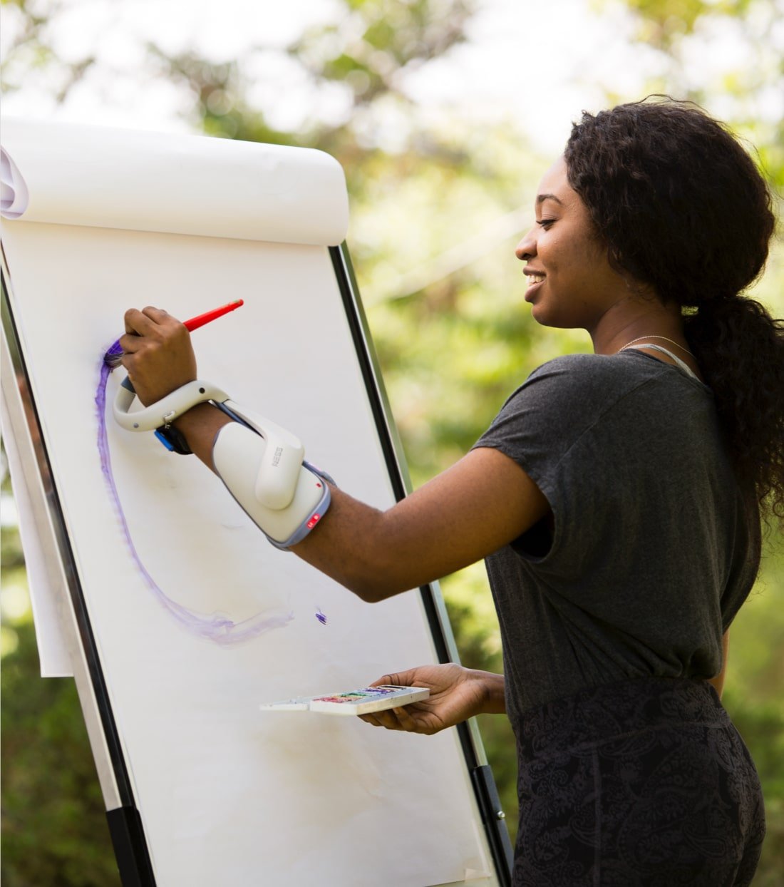 woman painting with bioness on